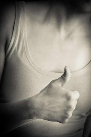 Women hand doing thumbs upの写真素材