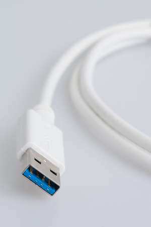 White USB Cable on a white backrgoundの写真素材