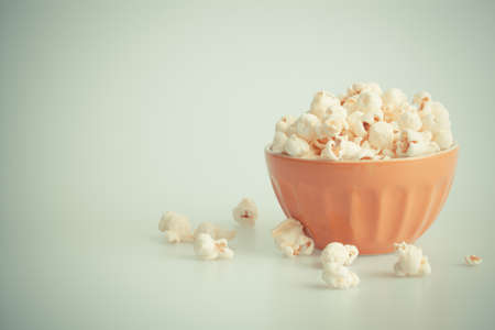 Orang popcorn bowl on a white backgroundの写真素材