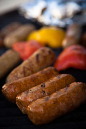 Sausages and red peper on the BBQ grillの写真素材