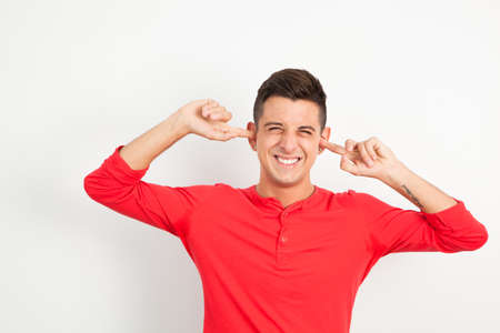 Young and handsome guy posing over white backgroundの写真素材