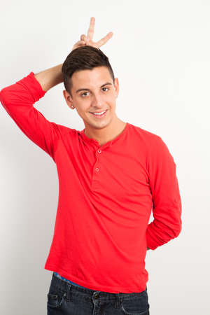 Young and handsome guy posing over white backgroundの写真素材