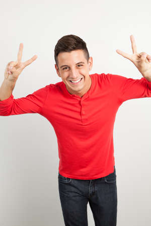 Young and handsome guy posing over white backgroundの写真素材