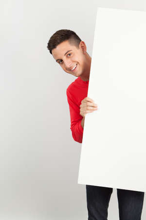 Young and handsome guy posing over white backgroundの写真素材