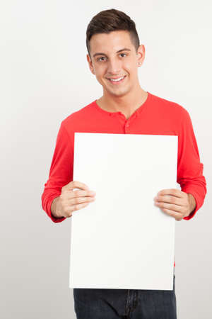 Young and handsome guy posing over white backgroundの写真素材