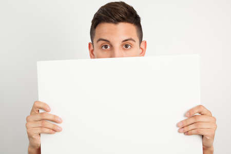 Young and handsome guy posing over white backgroundの写真素材