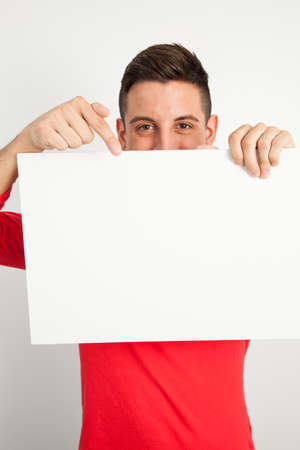 Young and handsome guy posing over white backgroundの写真素材