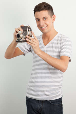 Young man posing against a white backgroundの写真素材