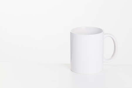 White ceramic cup on a white backgroundの写真素材
