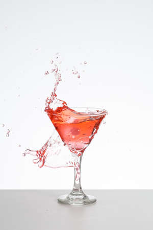 Red cocktail with ice splashの写真素材