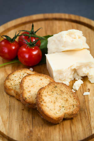 Cheese and tomato plate with breadの写真素材
