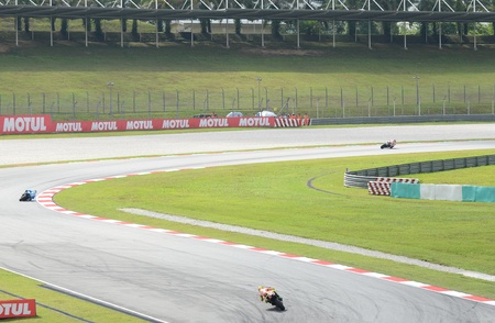 SEPANG, MALAYSIA - OCTOBER 21: Three MotoGP riders take in cornering action during MotoGP Test Day at Sepang International Circuit on October 21, 2011 in Sepang, Malaysia. のeditorial素材