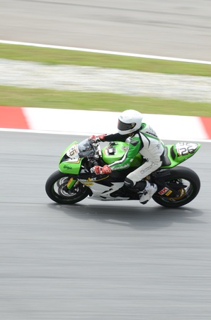 SEPANG, MALAYSIA - OCTOBER 21: Riders of 250cc race at Malaysian MotoGP 2011 Sepang International Circuit Malaysia on October 21, 2011 in Sepang, Malaysia. のeditorial素材