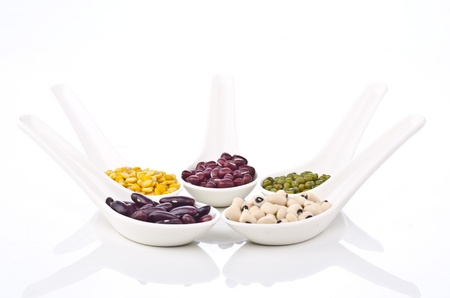 Beans and spices - colorful with in white spoon