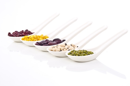 Beans and spices - colorful with in white spoonの写真素材