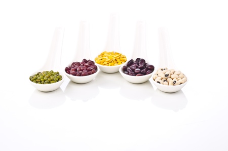 Beans and spices - colorful with in white spoon