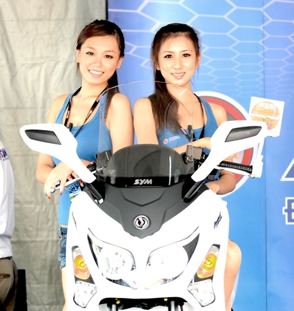 SEPANG, MALAYSIA - OCT 21: Unidentified motoshow Girl as scooter moto bike model at 2011 MotoGP on October 21, 2011 in Sepang, Malaysia.のeditorial素材