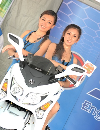 SEPANG, MALAYSIA-OCT 21: Model of scooter in motorshow exhibition for Malaysian Motorcycle Grand Prix 2011 free practice session on October 21, 2011 at Sepang, Malaysia.のeditorial素材
