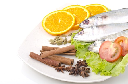 Fresh fish decorated on cream platesの写真素材