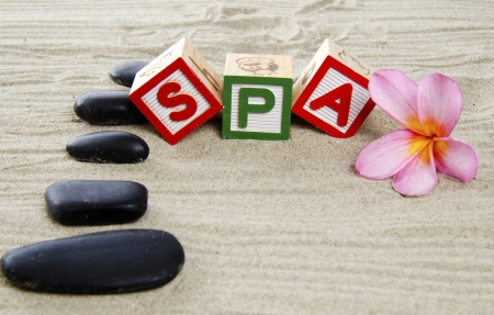 Spa concept with  frangipani, stones and sand の写真素材