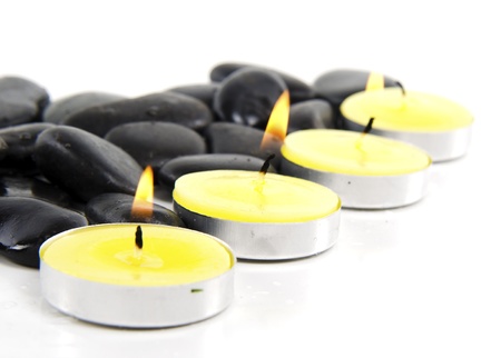 Spa concept with zen stones and lemon flavour candle の写真素材