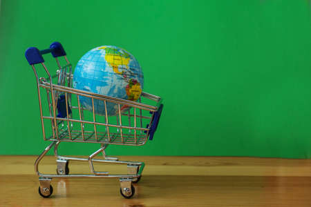 Little earth planet in shopping cart. Sale concept.の写真素材