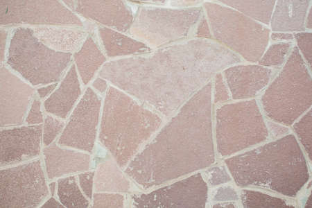 Big brown stone in the wall background