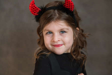 Emotional European little girl in haloween damn costume closeup portrait