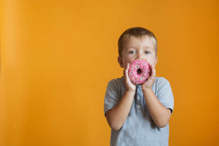 Boy holding donut background.