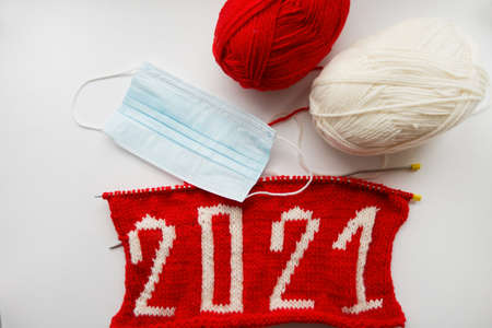 2021 Happy New Year. Knitted number. skeins of yarn, medical maskの写真素材
