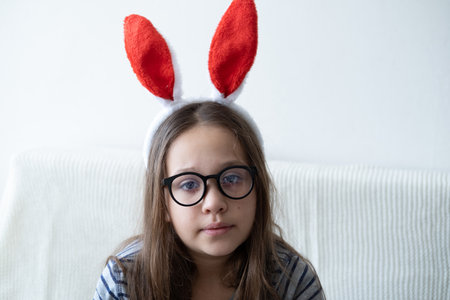 little cute girl in bunny ears in glasesses. easterの写真素材