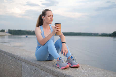 Young fitness woman finish running in the cityの写真素材