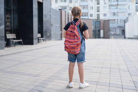 Rare view of girl with backpack go to schoolの写真素材
