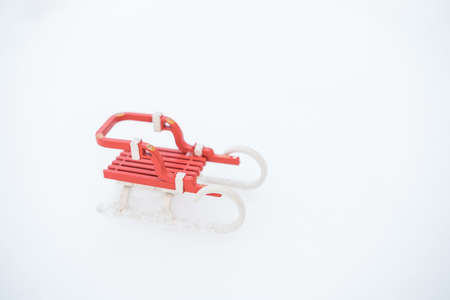 Christmas sleigh toy on snow. merry christmasの写真素材
