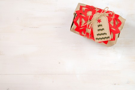 Different Christmas presents with handmade decoration on wooden backgroundの写真素材