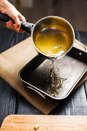 hot sugar syrup in the dark still formの写真素材