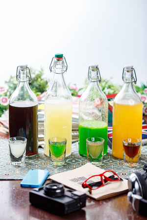 coctails in glassy bottles and glassの写真素材