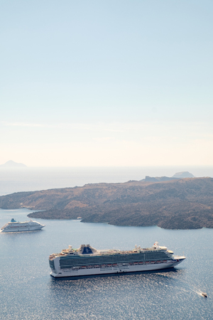 Santorini - The islands Nea Kameni and Palea Kameni and the south part of the Island in background.の写真素材