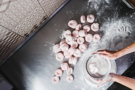 Cooking strawberry pink marshmallows in a professional kitchen