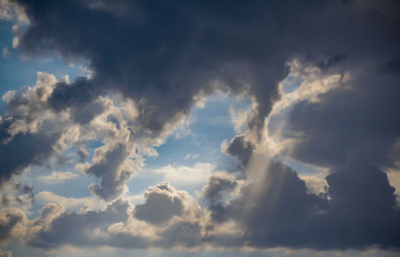 a thundercloud. sunset. The sun is closed by a cloud