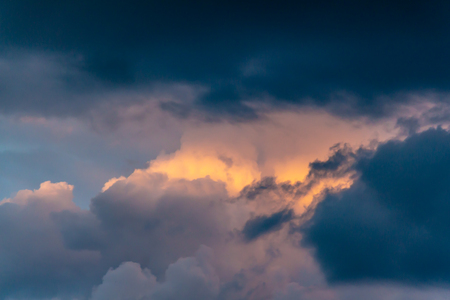 Evening. approaching thunderstorm. The sun disappeared behind the clouds. Abstraction. Textureの写真素材