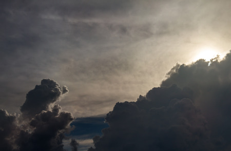 Thunderclouds. dramatic scene. The sun is absorbed by the clouds. The smoke in the sky and the strong windの写真素材