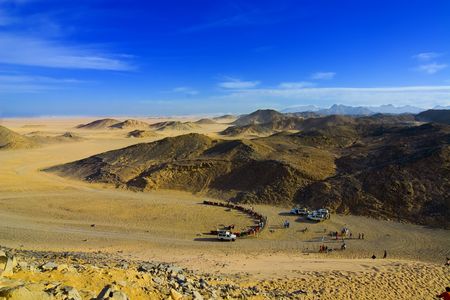 Desert, waves, golden sand and sky.の写真素材