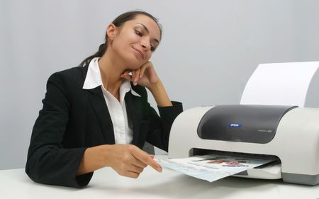 Business woman is  printing in office