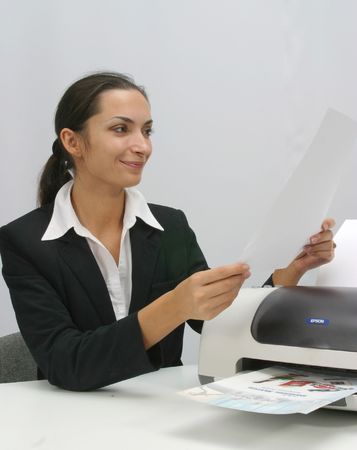 Business woman is  printing in office