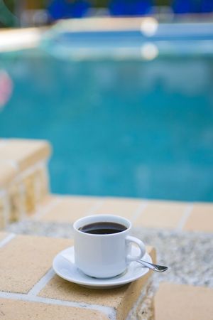 cup coffee on background of the poolの写真素材