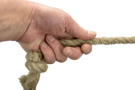 Hand keeps rope with node on white background