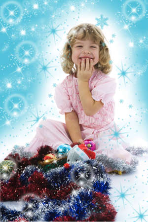 Beautiful little girl with christmas decoration on isolated backgroundの写真素材