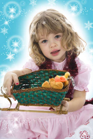 Beautiful little girl with christmas decoration on isolated backgroundの写真素材