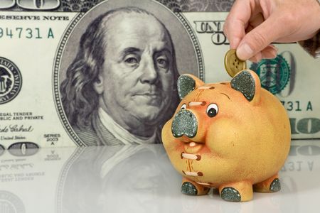 Piggy bank on big dollar background